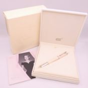 A Montblanc/Mont Blanc Princess Grace de Monaco ivory coloured rollerball pen, boxed with papers.