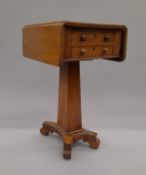 An early 19th century mahogany pedestal Pembroke work table. 33.5 cm wide flaps down.