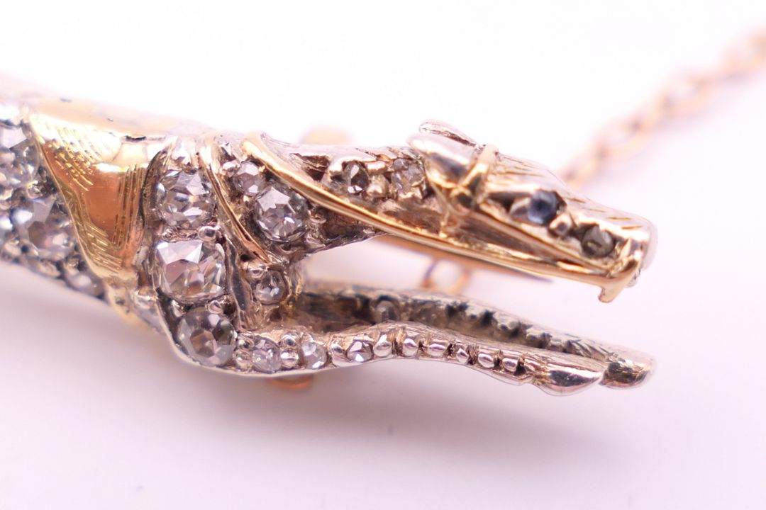 A diamond set unmarked gold racehorse brooch, possibly the horse ''Warmspun''. 3.5 cm long. 4. - Image 5 of 7