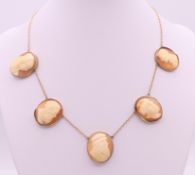 Five antique shell portrait cameos of classical subjects formed as a 9 ct gold necklace.