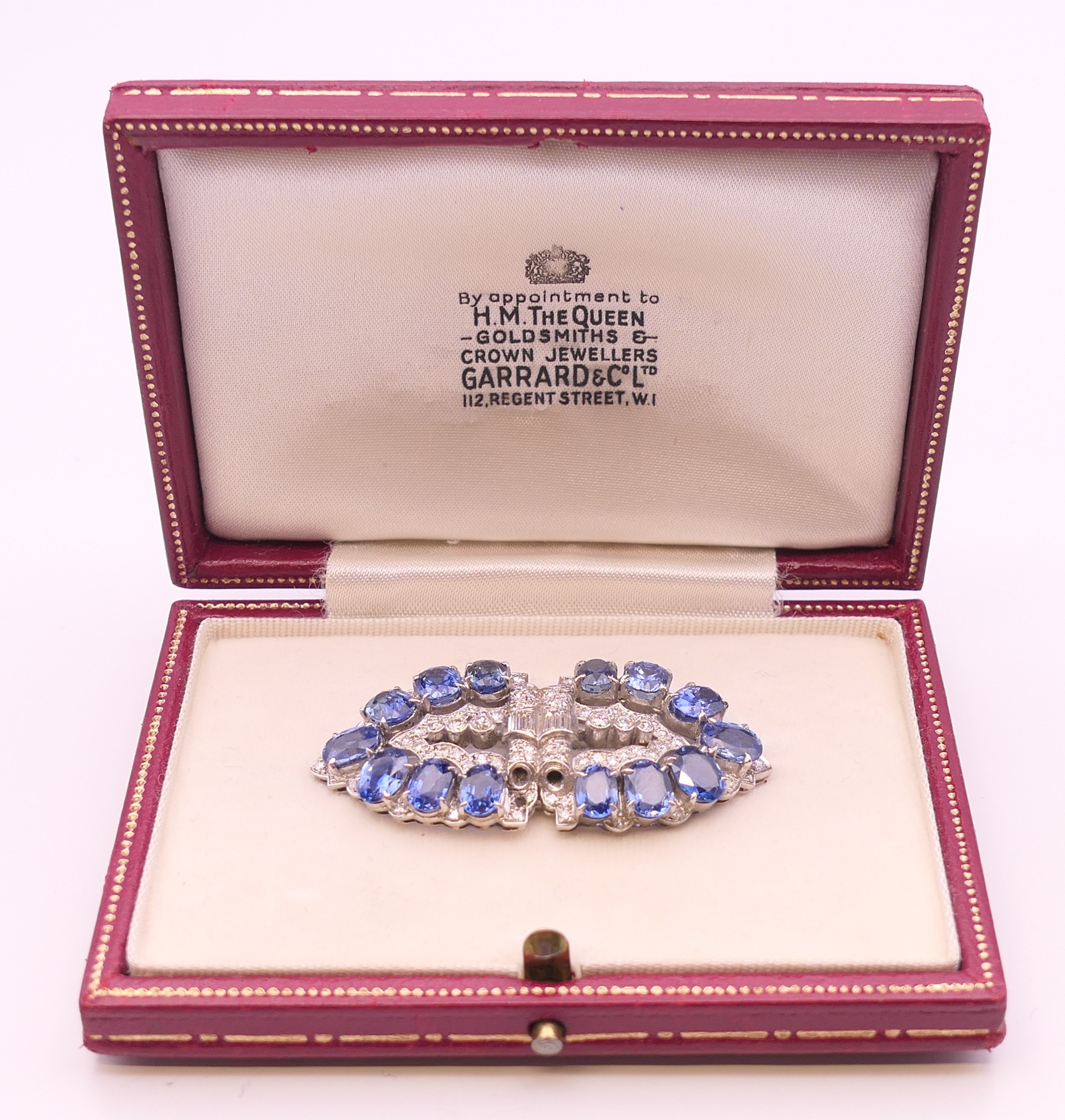 An unmarked Garrard and Co Ltd sapphire and diamond brooch, cased. 5 cm x 2 cm. - Image 16 of 19