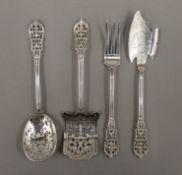 A set of four Continental pierced silver patisserie servers and eaters. The largest 17 cm long. 100.
