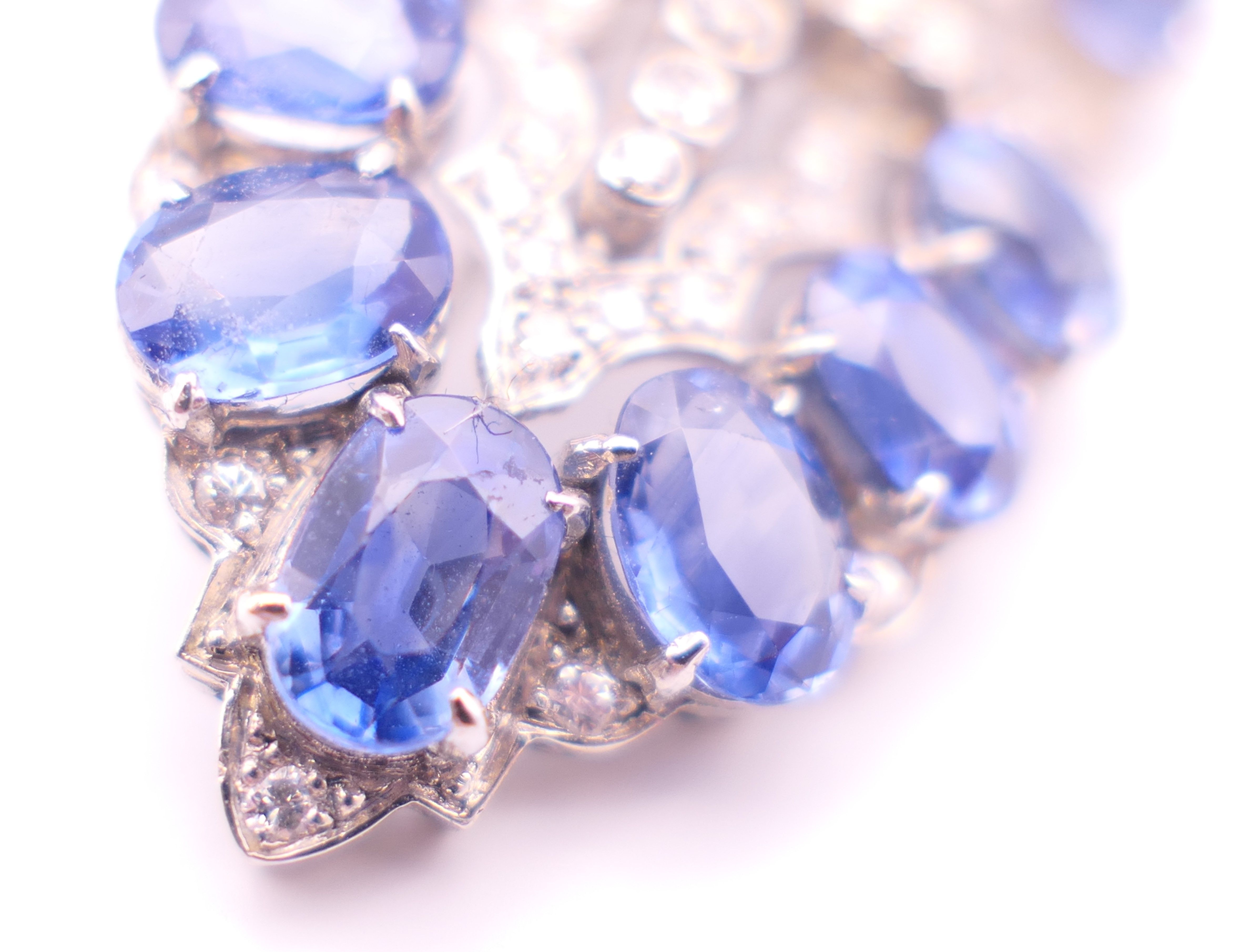 An unmarked Garrard and Co Ltd sapphire and diamond brooch, cased. 5 cm x 2 cm. - Image 6 of 19