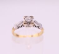 An 18 ct gold solitaire diamond ring. Ring size L. 2.8 grammes total weight.
