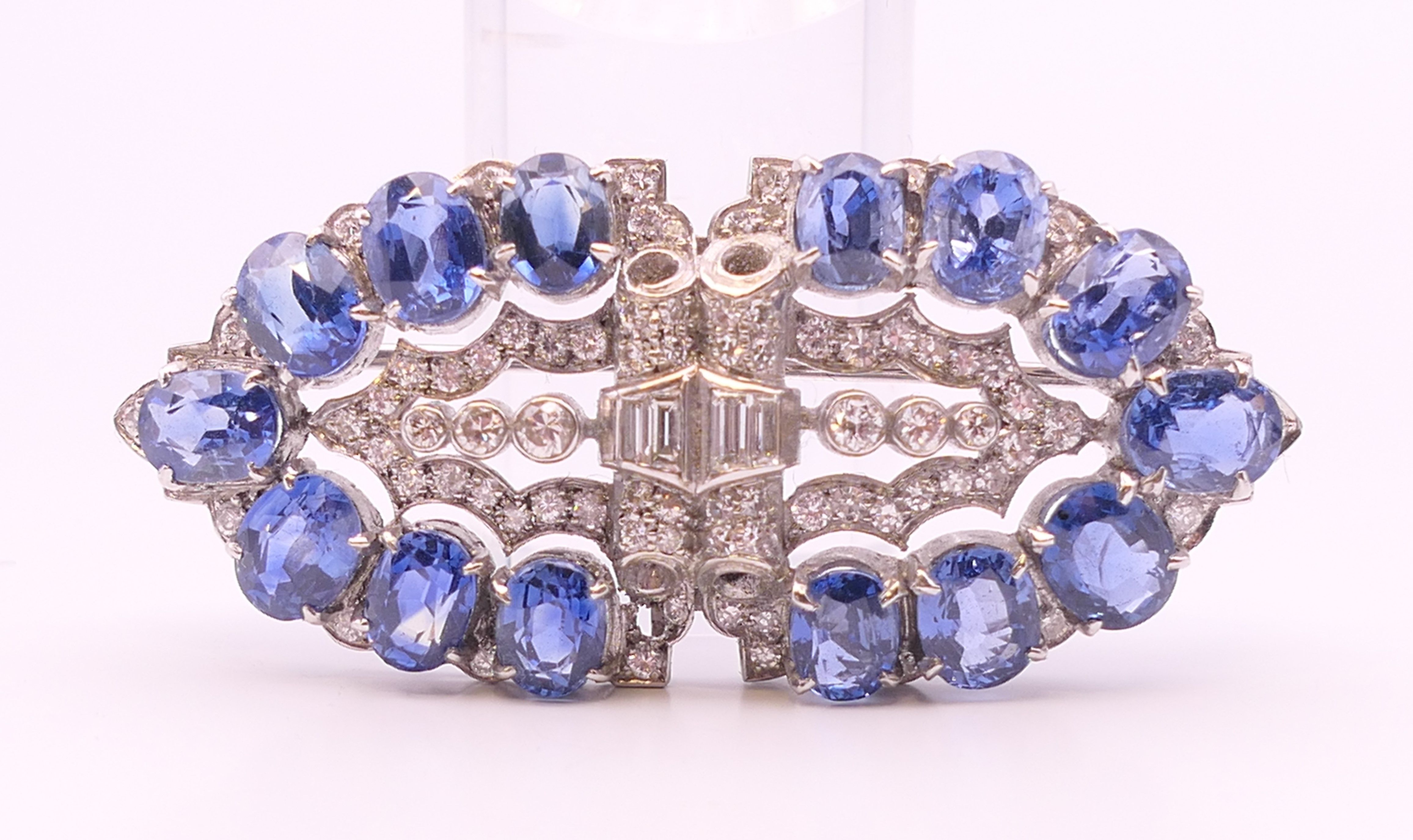 An unmarked Garrard and Co Ltd sapphire and diamond brooch, cased. 5 cm x 2 cm. - Image 12 of 19