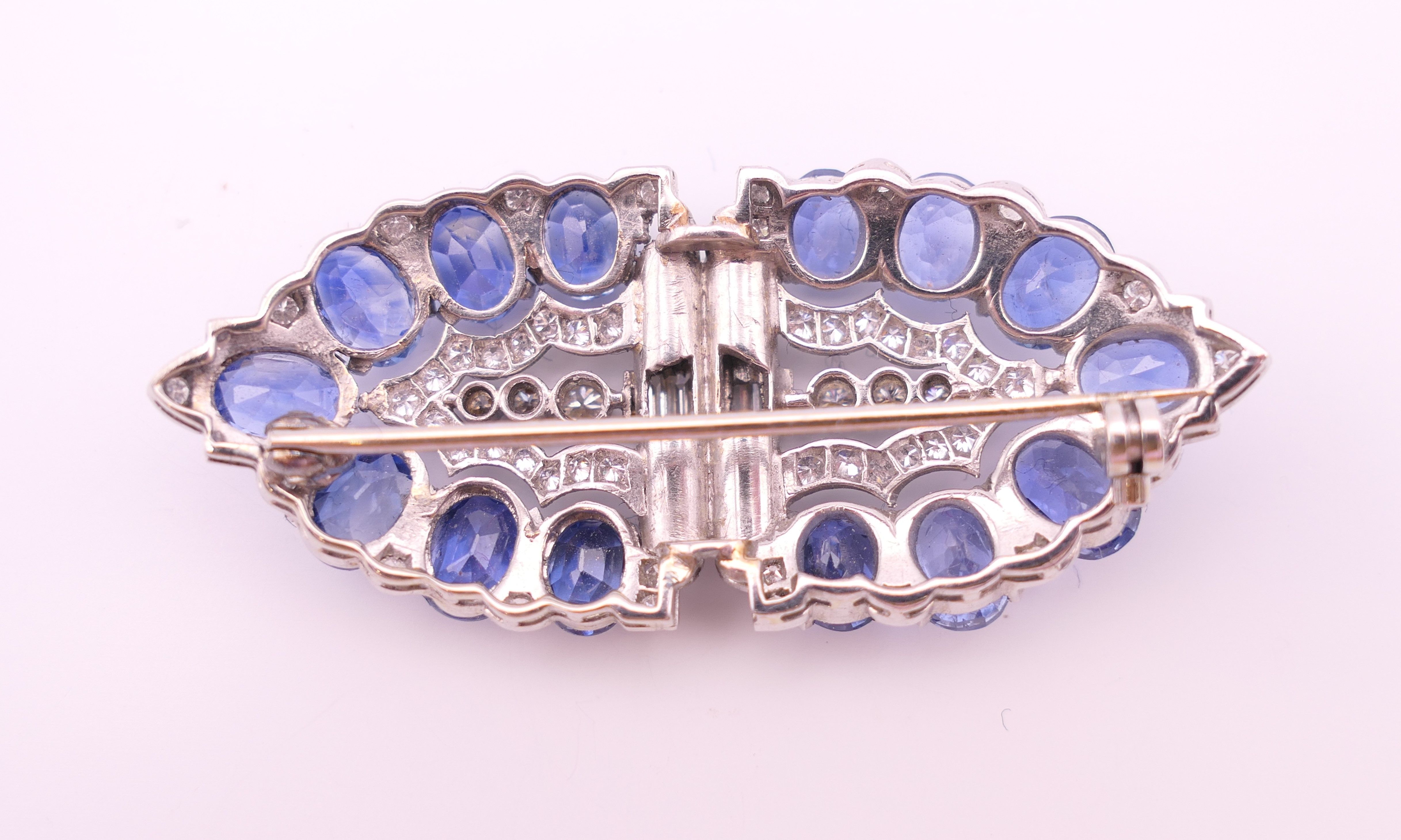 An unmarked Garrard and Co Ltd sapphire and diamond brooch, cased. 5 cm x 2 cm. - Image 3 of 19