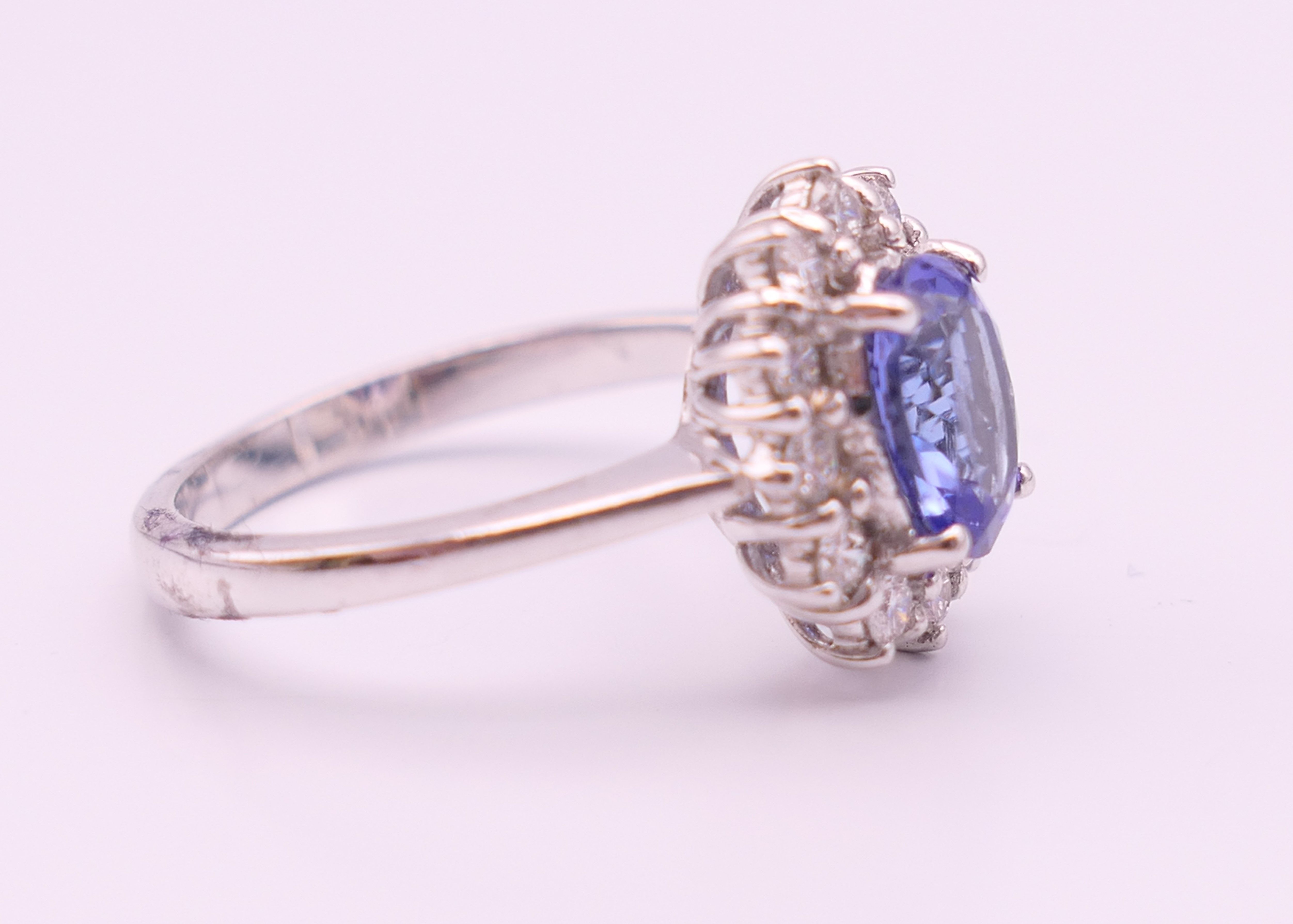 An 18 ct white gold sapphire and diamond ring. The sapphire approximately 1 carat. Ring size N. - Image 2 of 8