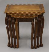 A nest of four Eastern carved tables. 45.5 cm wide.