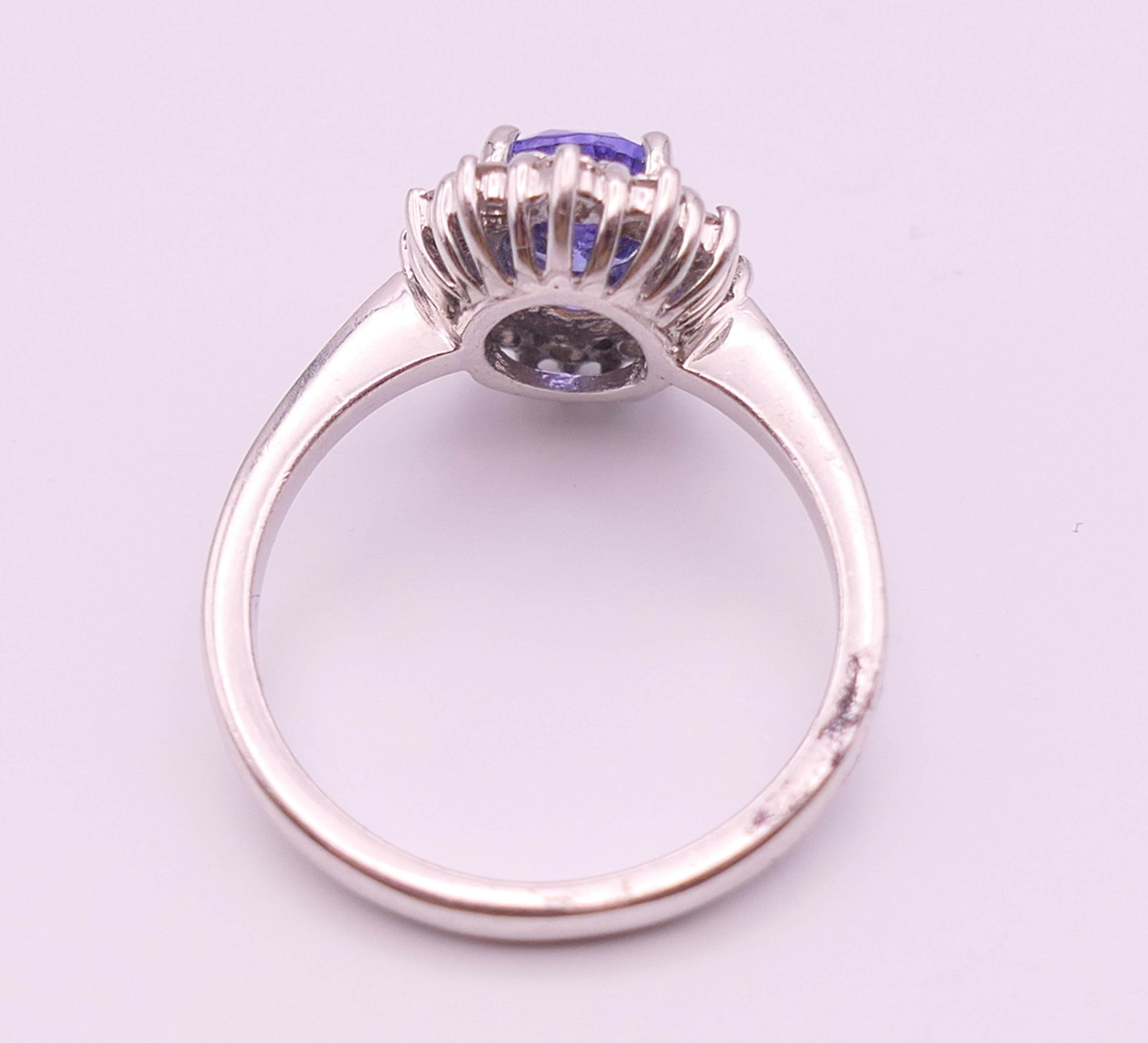 An 18 ct white gold sapphire and diamond ring. The sapphire approximately 1 carat. Ring size N. - Image 3 of 8