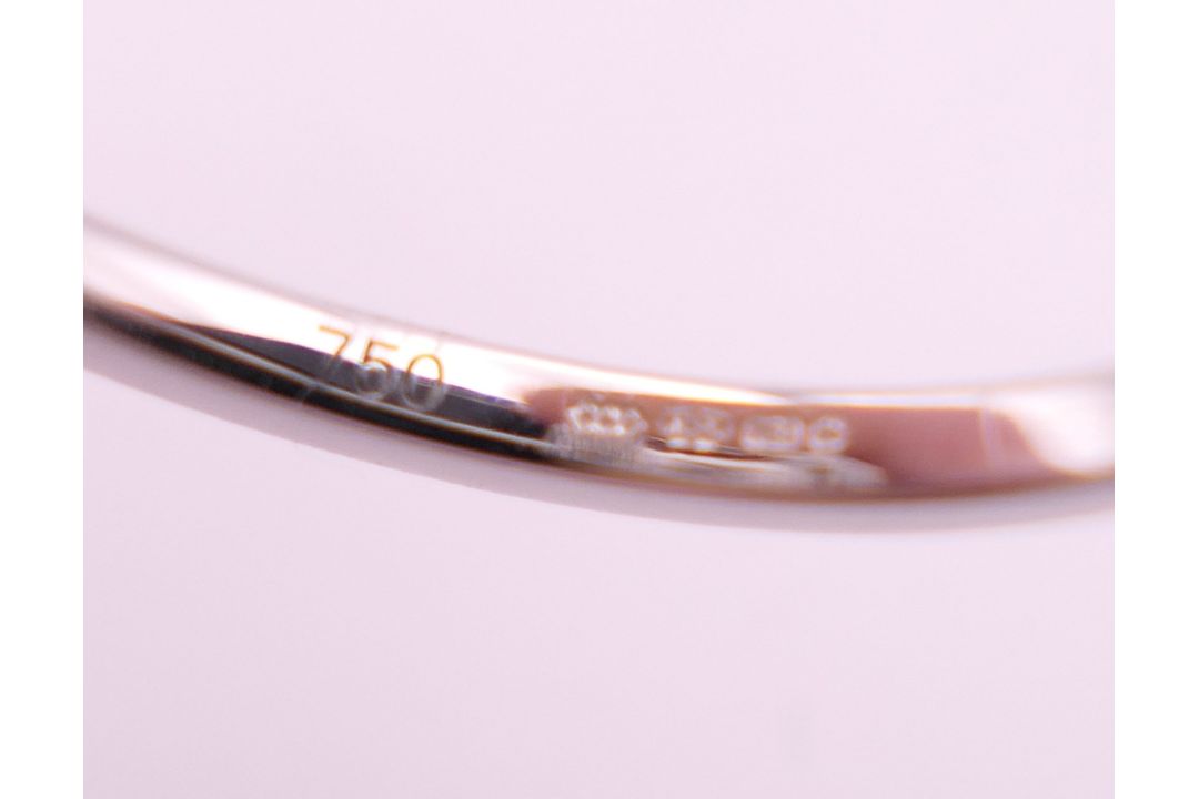 An 18 ct white gold ring with 5 baguette cut diamonds surrounded by numerous brilliant cut diamonds. - Image 7 of 8