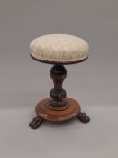 A Victorian upholstered rosewood revolving piano stool.