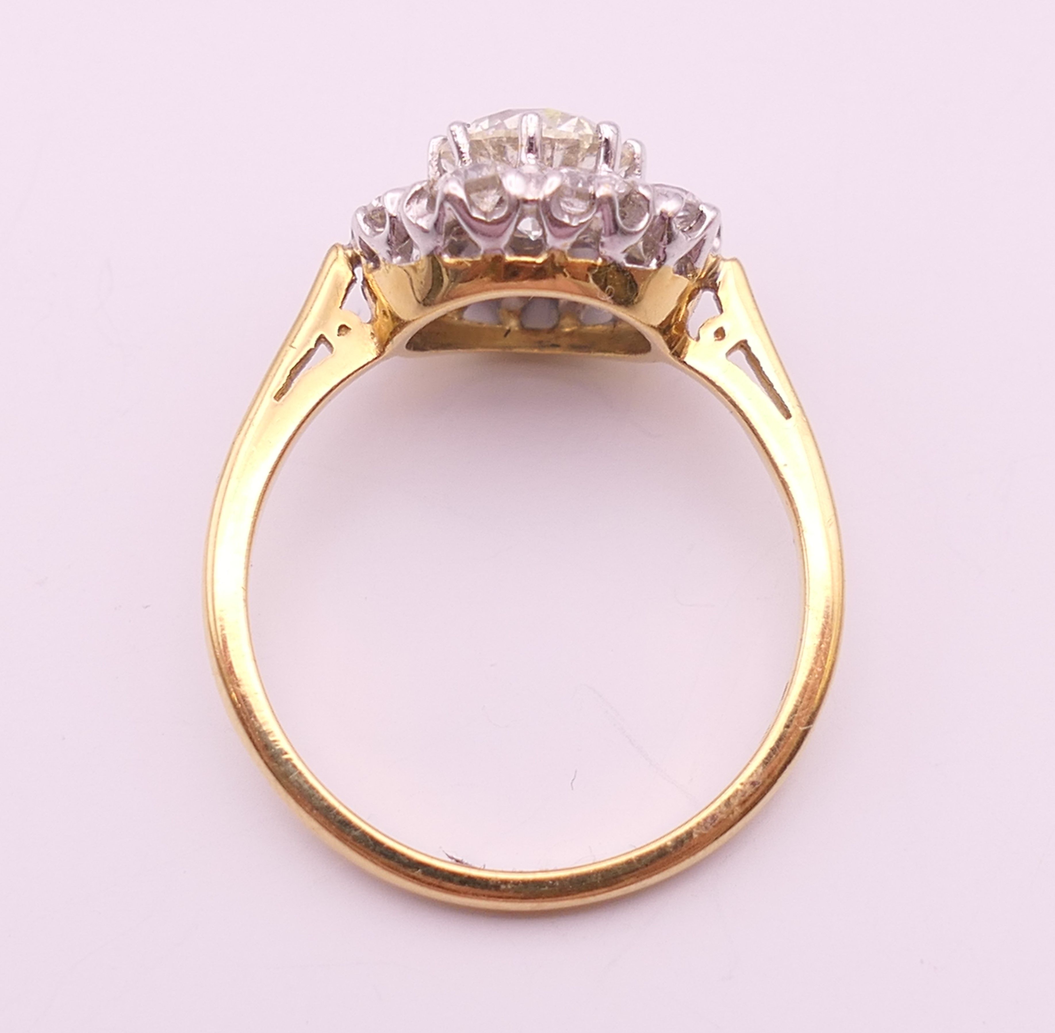 An 18 ct gold and diamond flowerhead ring. Total diamond weight approximately 1.85 carats. - Image 6 of 7