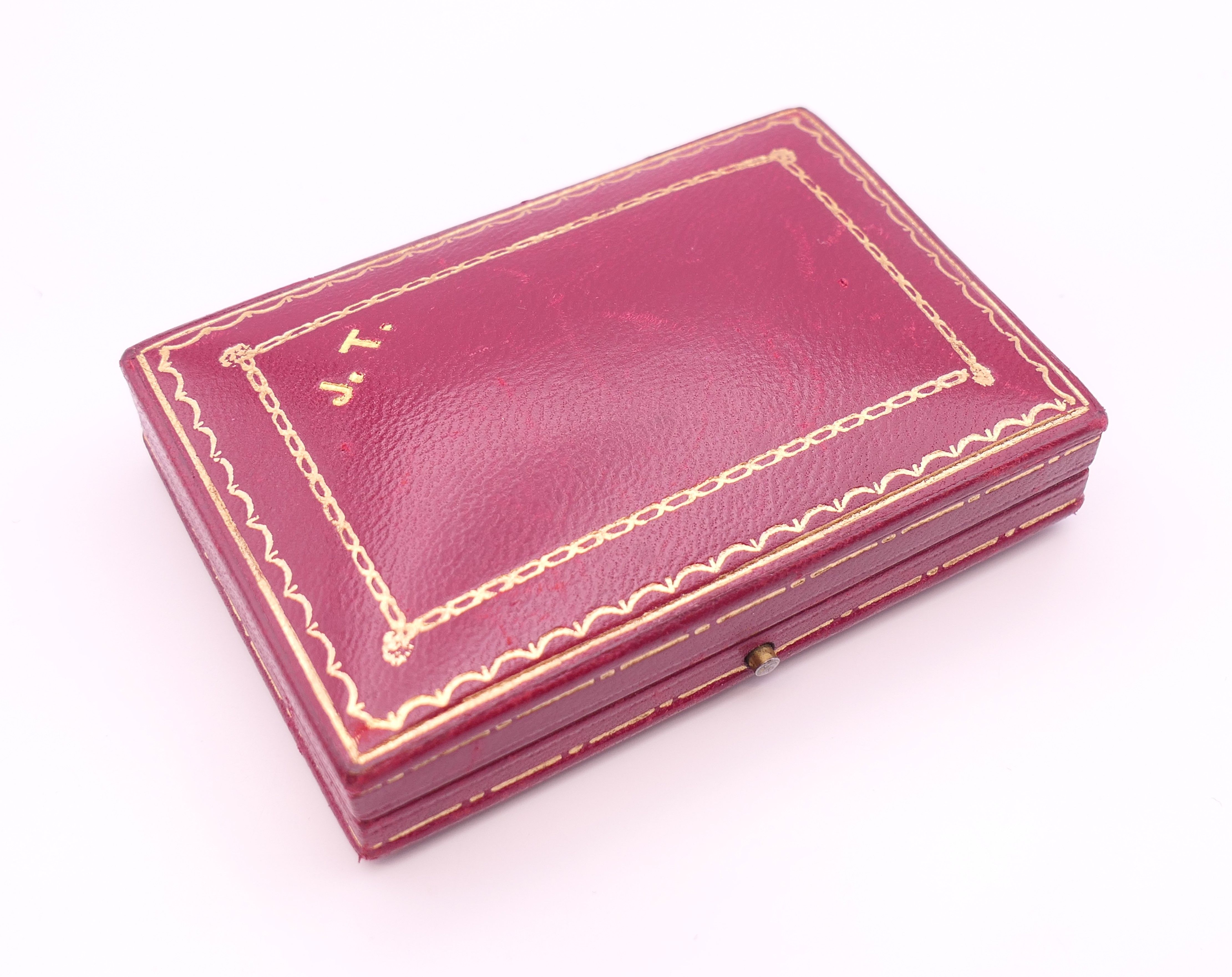 An unmarked Garrard and Co Ltd sapphire and diamond brooch, cased. 5 cm x 2 cm. - Image 19 of 19