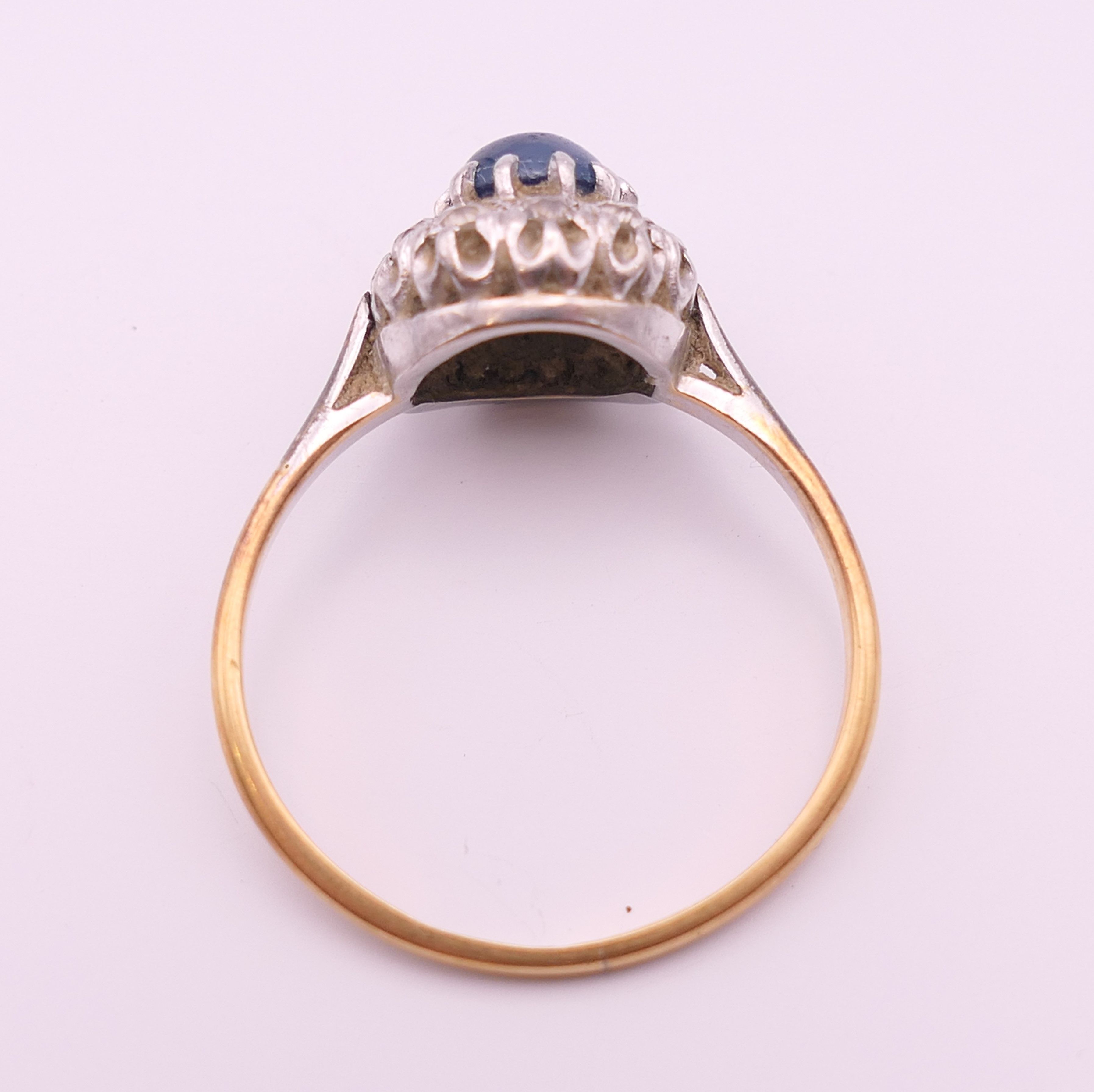 An 18 ct gold and platinum cabochon sapphire and diamond cluster ring. Ring size Q. - Image 5 of 7