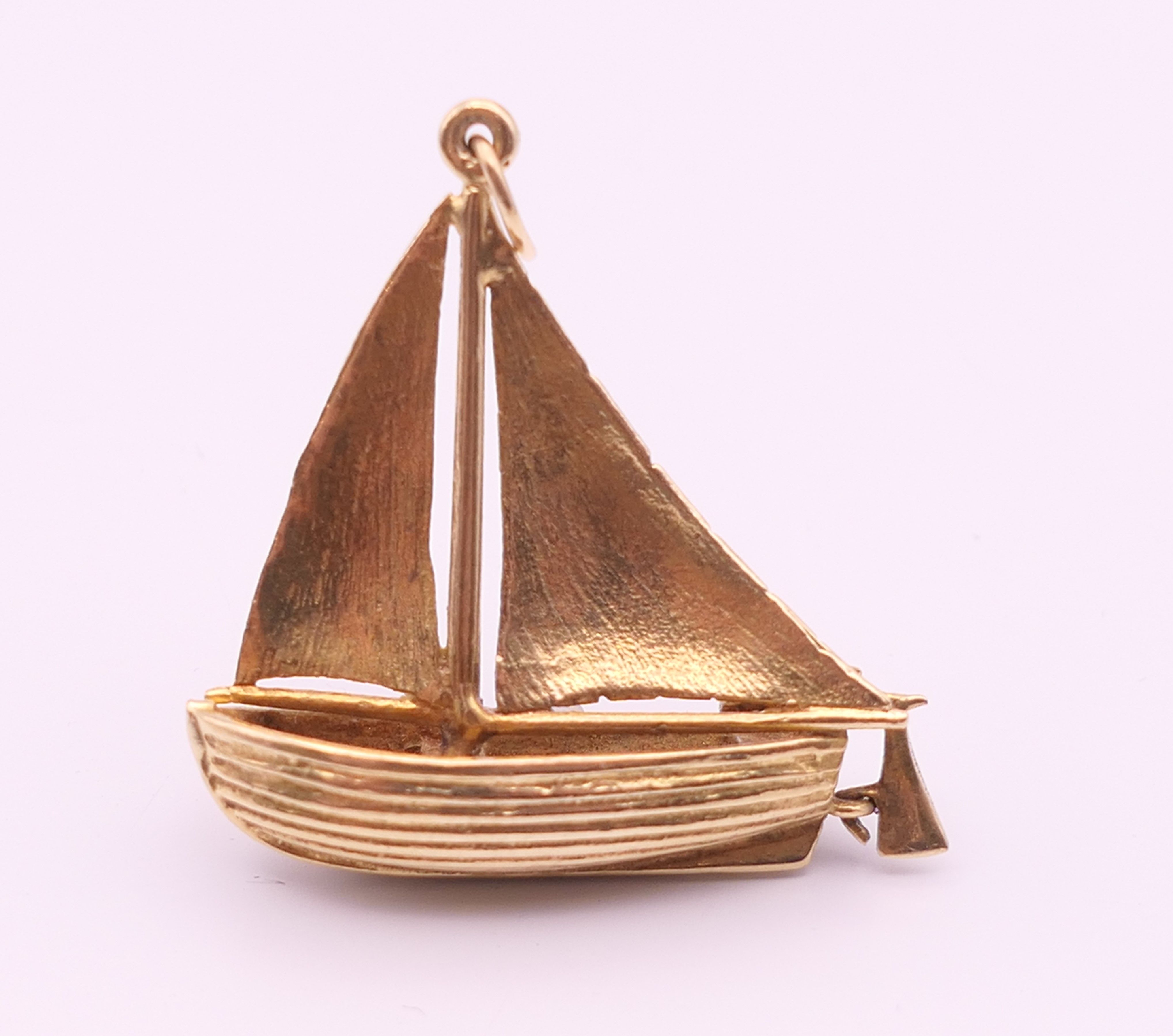 A 9 ct gold pendant formed as a sailing boat. 3 cm x 3.25 cm high. 6.9 grammes. - Image 3 of 5