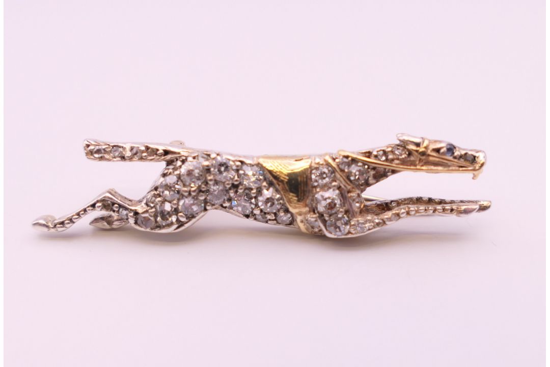 A diamond set unmarked gold racehorse brooch, possibly the horse ''Warmspun''. 3.5 cm long. 4. - Image 1 of 7