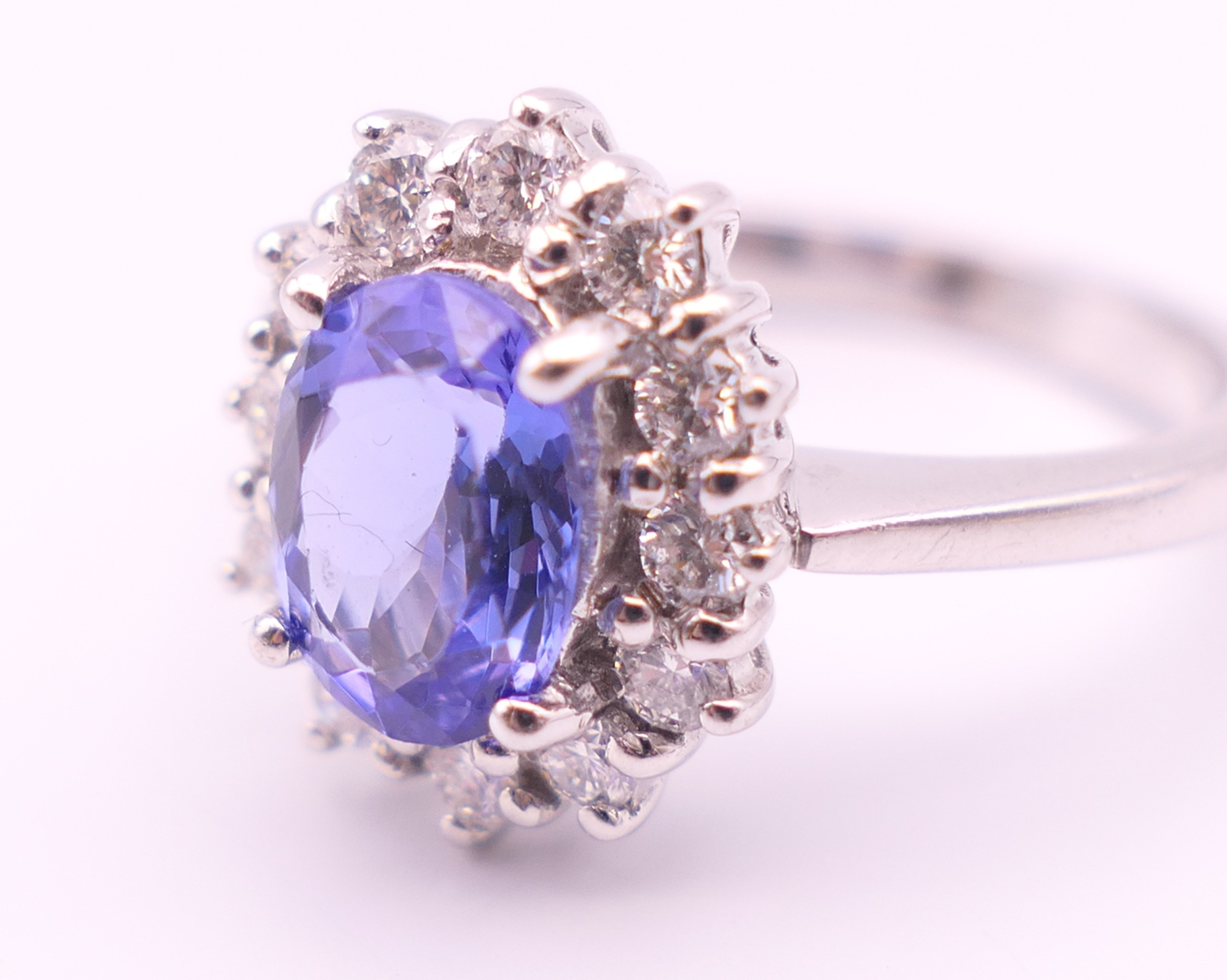 An 18 ct white gold sapphire and diamond ring. The sapphire approximately 1 carat. Ring size N. - Image 5 of 8