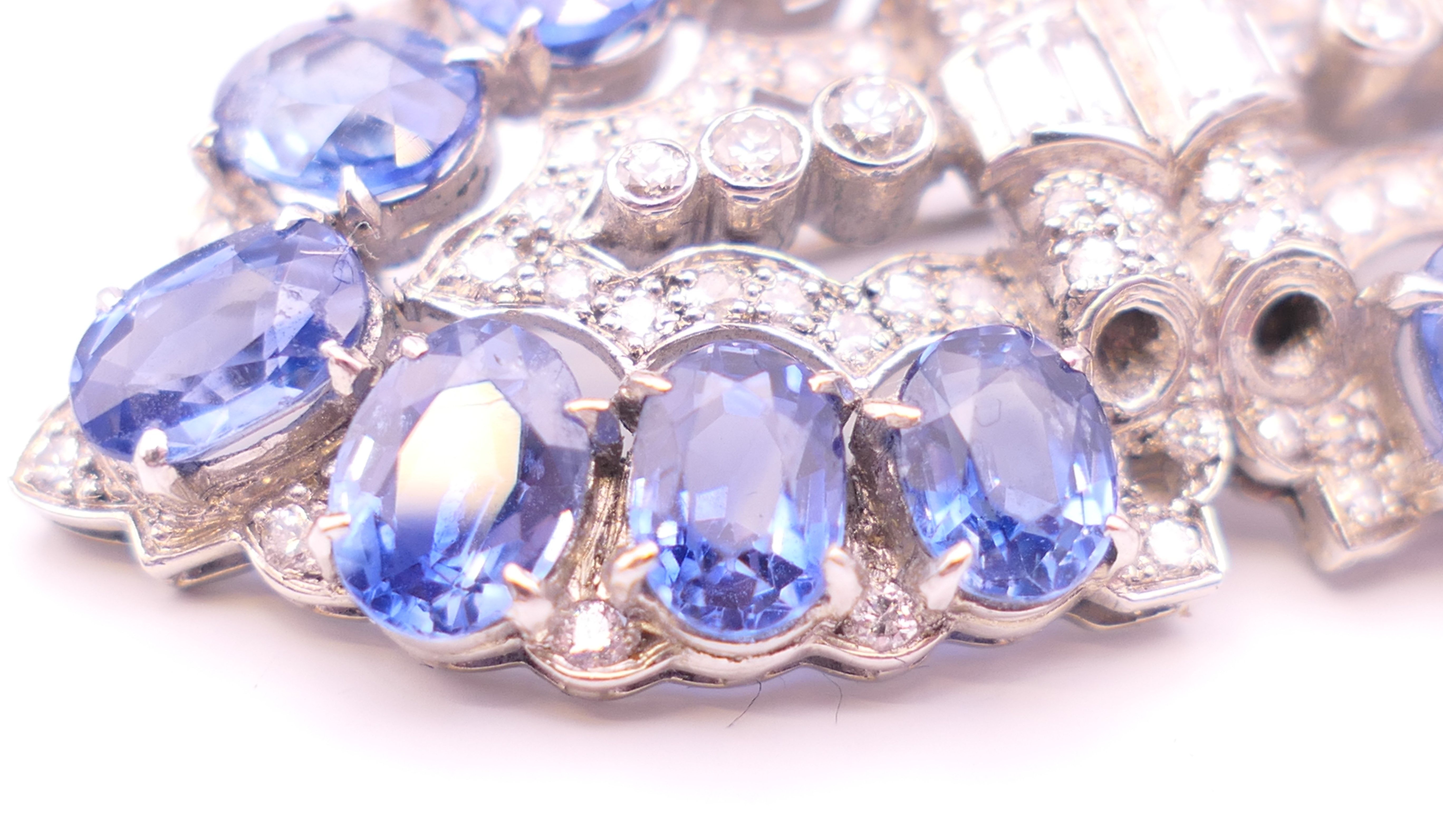 An unmarked Garrard and Co Ltd sapphire and diamond brooch, cased. 5 cm x 2 cm. - Image 5 of 19