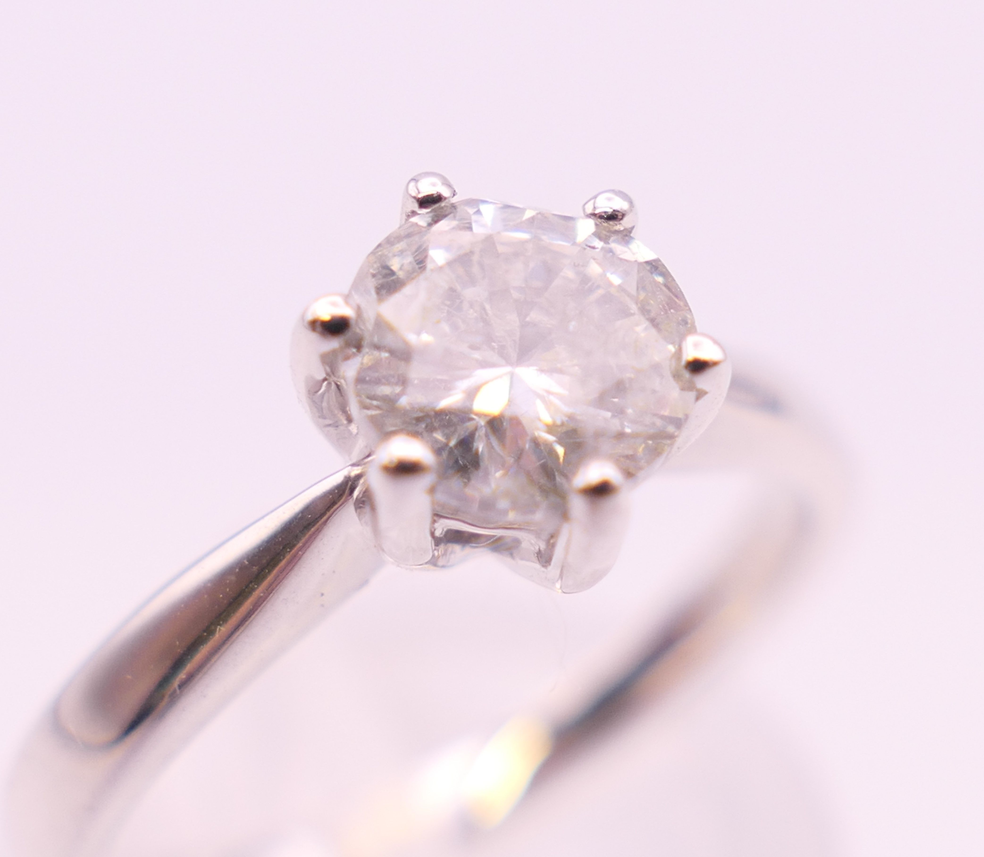An 18 ct white gold diamond solitaire ring, the stone approximately 0.8 carat. Ring size M. - Image 4 of 6