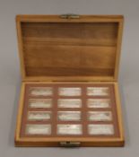A boxed set of 12 Royal Palaces silver ingots. Each 31.3 grammes.