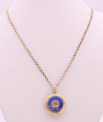 An antique unmarked gold and enamel buckle locket on chain. Locket 2.