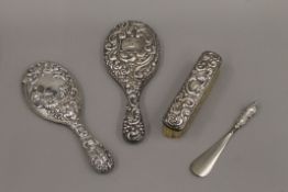 A silver backed dressing table set.