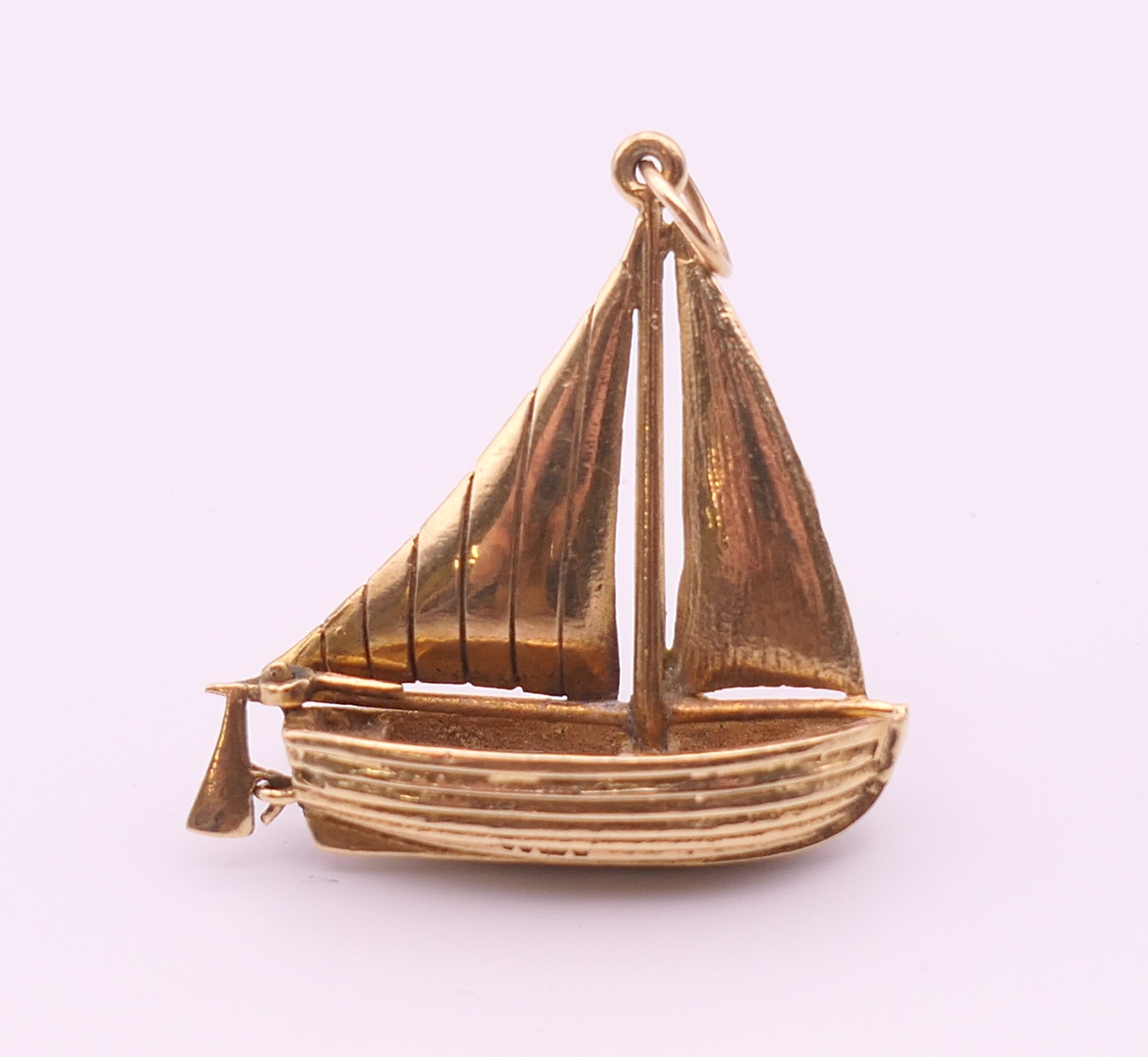A 9 ct gold pendant formed as a sailing boat. 3 cm x 3.25 cm high. 6.9 grammes. - Image 2 of 5