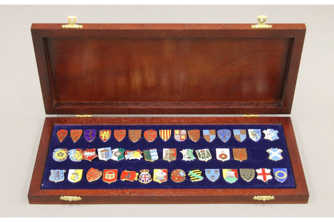 A boxed set of enamelled silver heraldic shield badges (one lacking). - Image 1 of 5