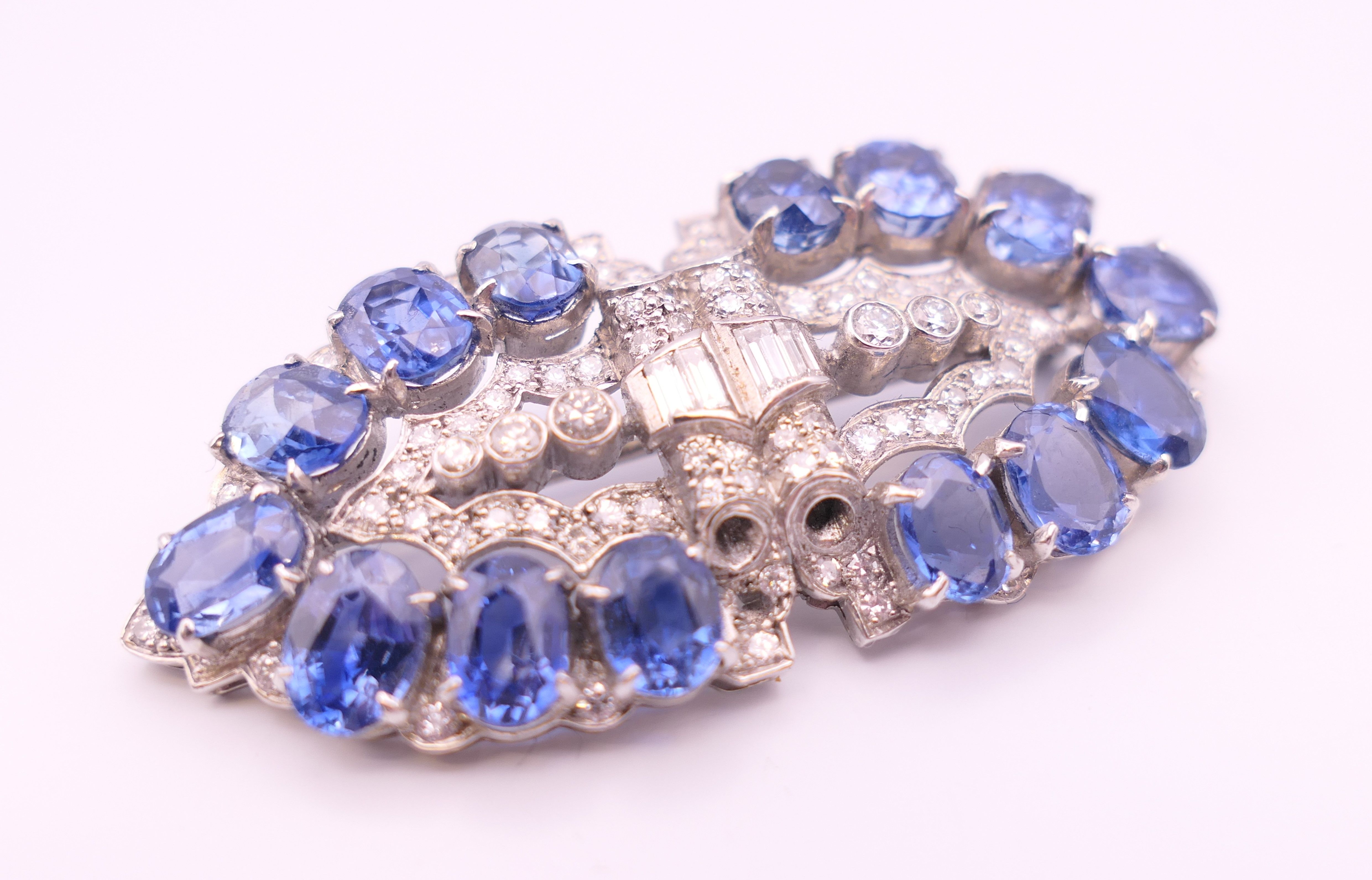 An unmarked Garrard and Co Ltd sapphire and diamond brooch, cased. 5 cm x 2 cm. - Image 4 of 19