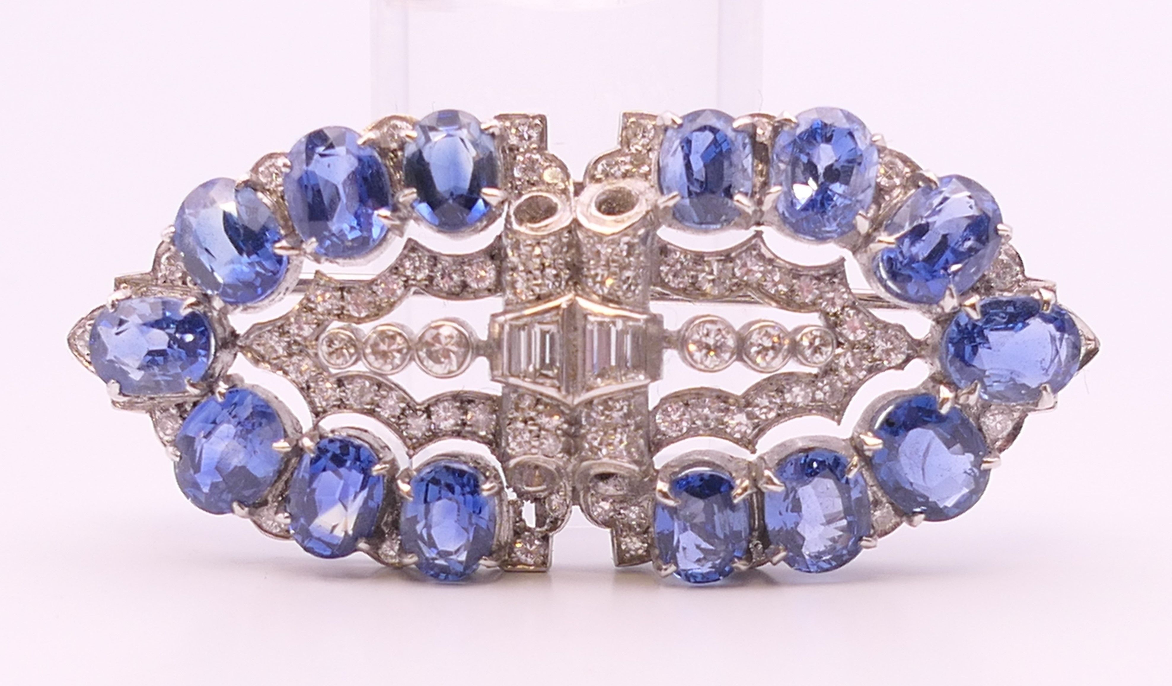 An unmarked Garrard and Co Ltd sapphire and diamond brooch, cased. 5 cm x 2 cm. - Image 11 of 19
