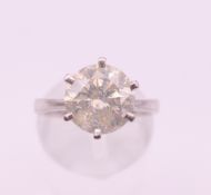 A platinum diamond solitaire ring. Diamond weight approximately 3 carats. Ring size K/L.