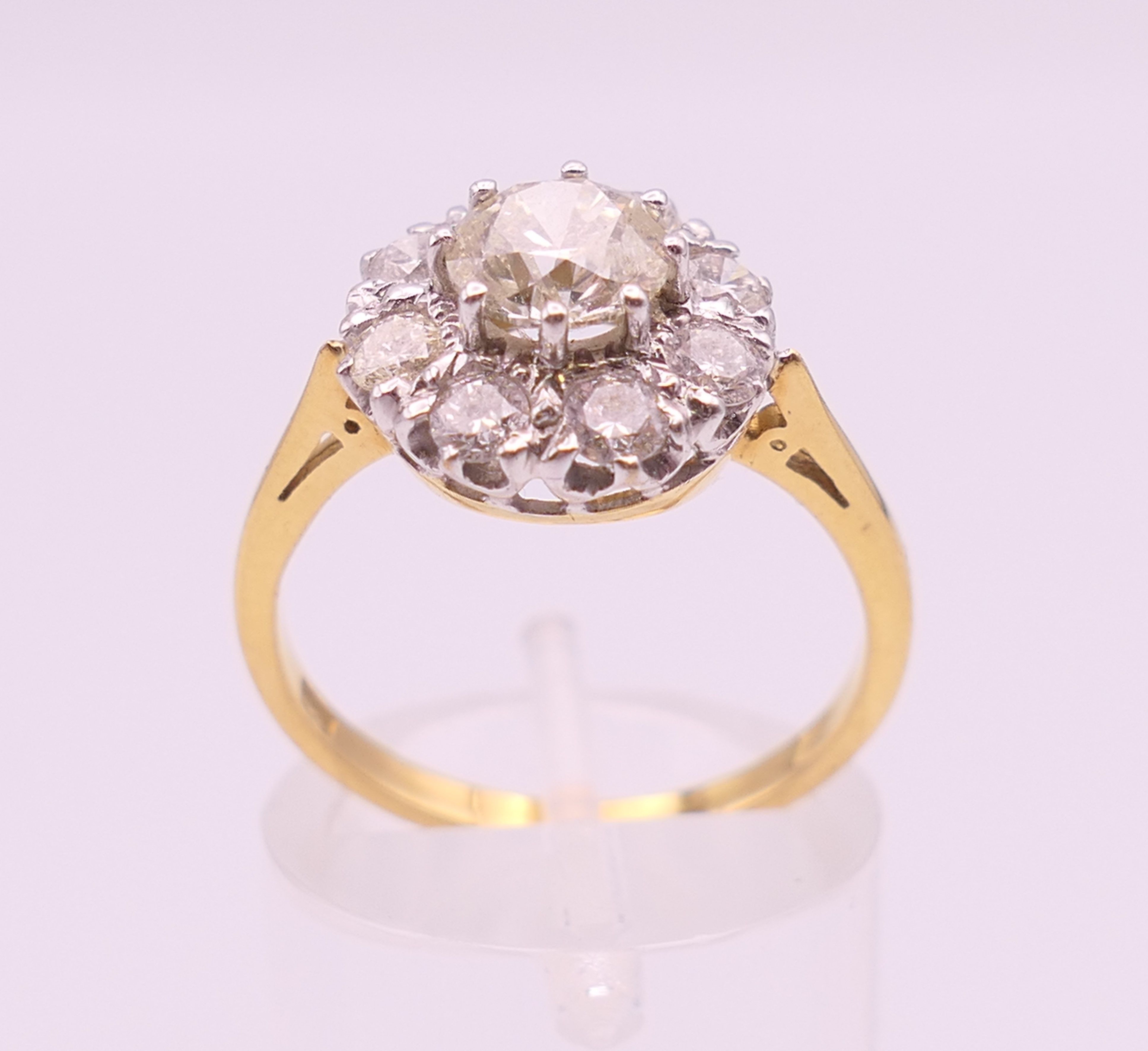 An 18 ct gold and diamond flowerhead ring. Total diamond weight approximately 1.85 carats. - Image 3 of 7