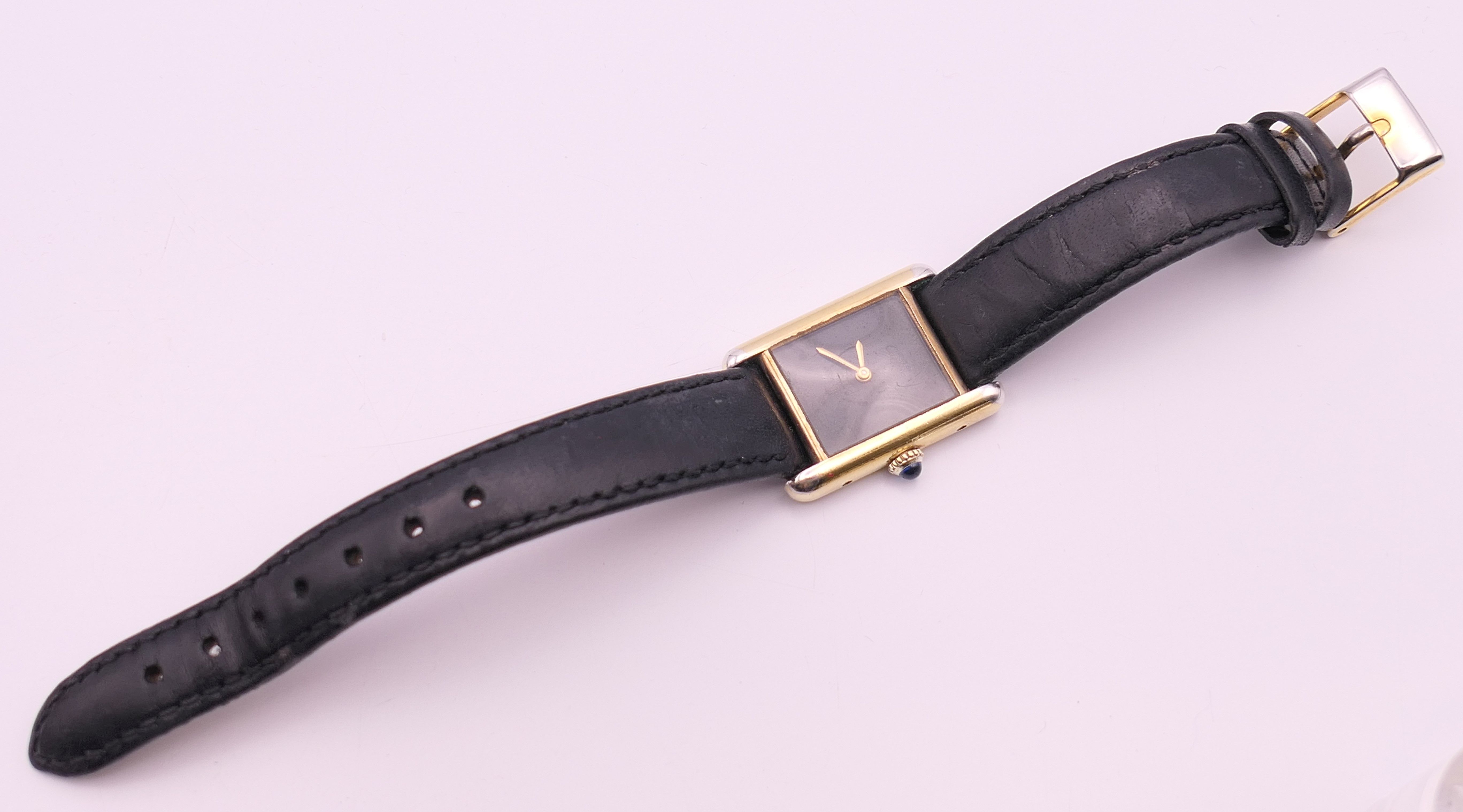 A Cartier ladies silver gilt wristwatch. 2.25 cm wide. - Image 7 of 9