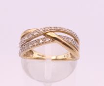 A 9 ct gold diamond ring. Ring size M. 3.2 grammes total weight.