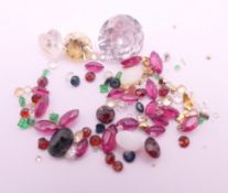 A quantity of various gemstones, including diamonds, emeralds, etc.