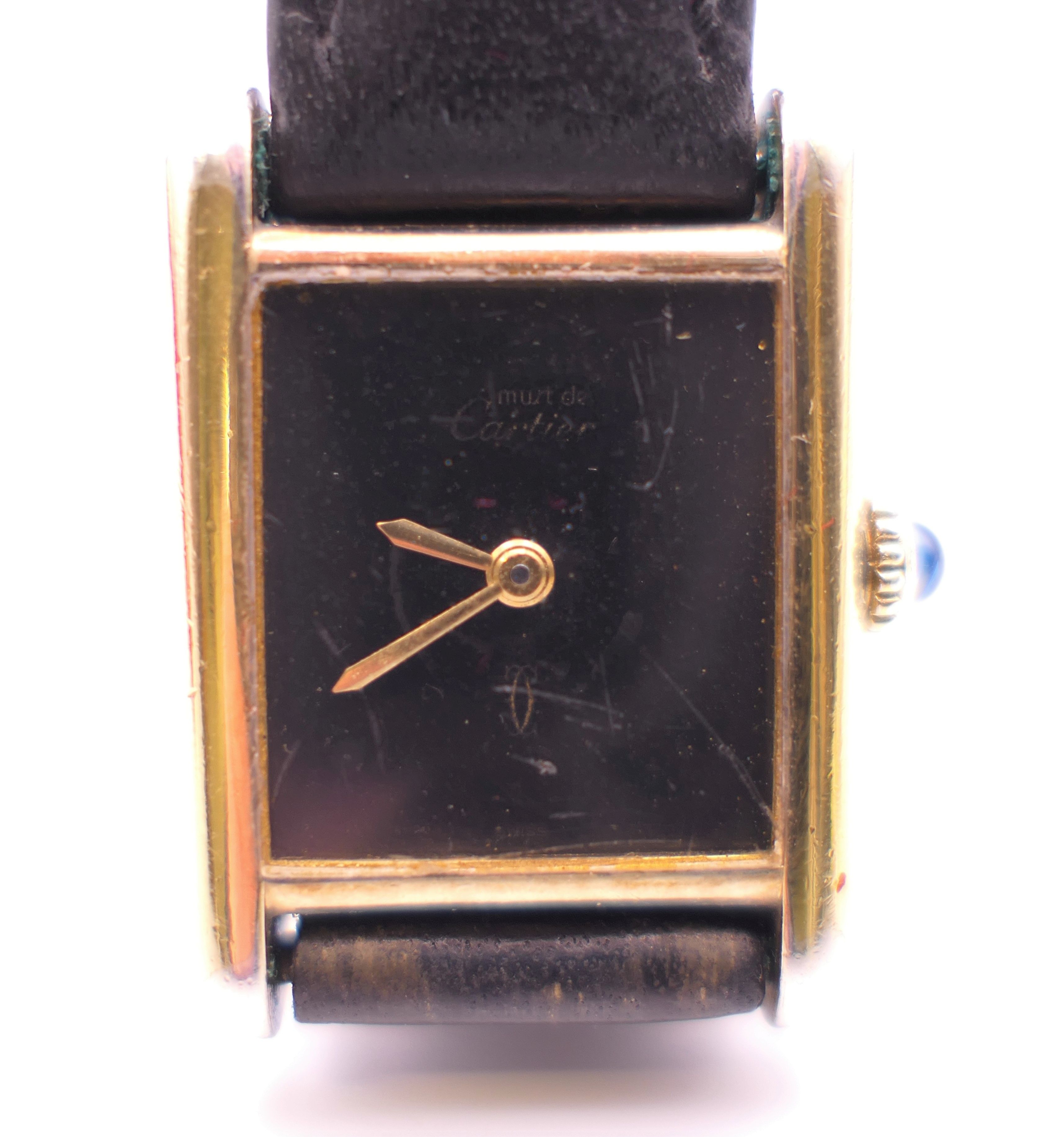 A Cartier ladies silver gilt wristwatch. 2.25 cm wide.