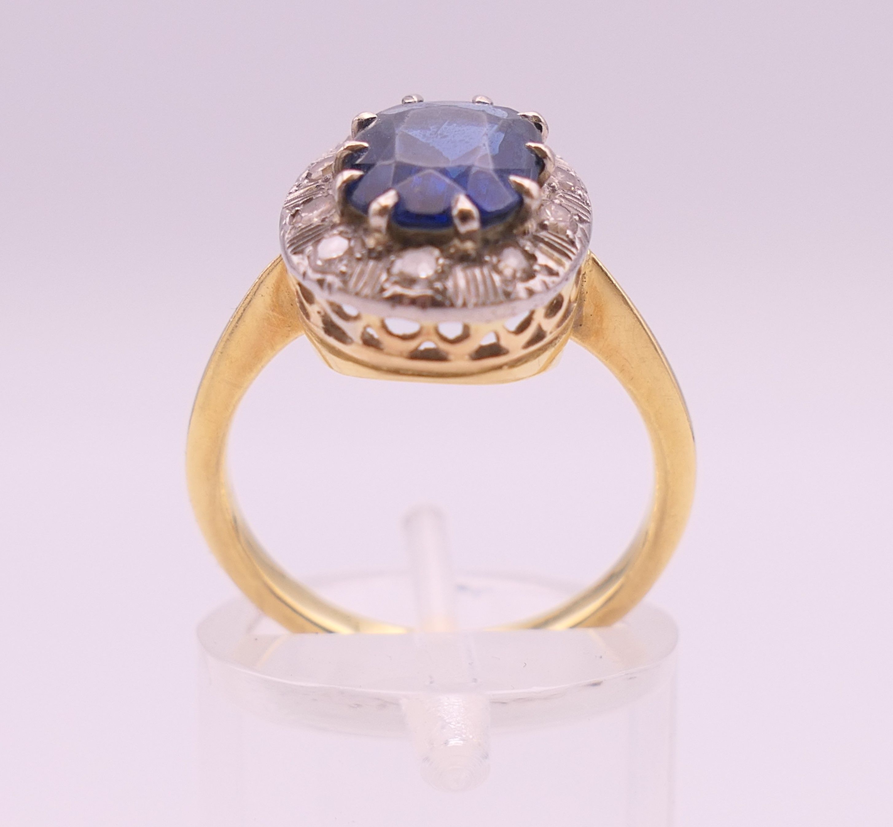 An unmarked gold sapphire and diamond ring. Ring size M/N. 4.2 grammes total weight. - Image 3 of 6