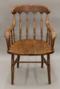 A Victorian turned stick back chair with bentwood arms. 56 cm wide.