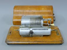 An early adding machine. 34 cm long.