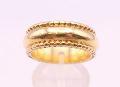 A Theo Fennell 18 ct gold band/ring, boxed and with paperwork of authenticity. Ring size R/S. 18.