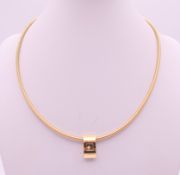 A Chopard 18 ct gold Happy Diamonds pendant necklace on a 18 ct gold wire chain,