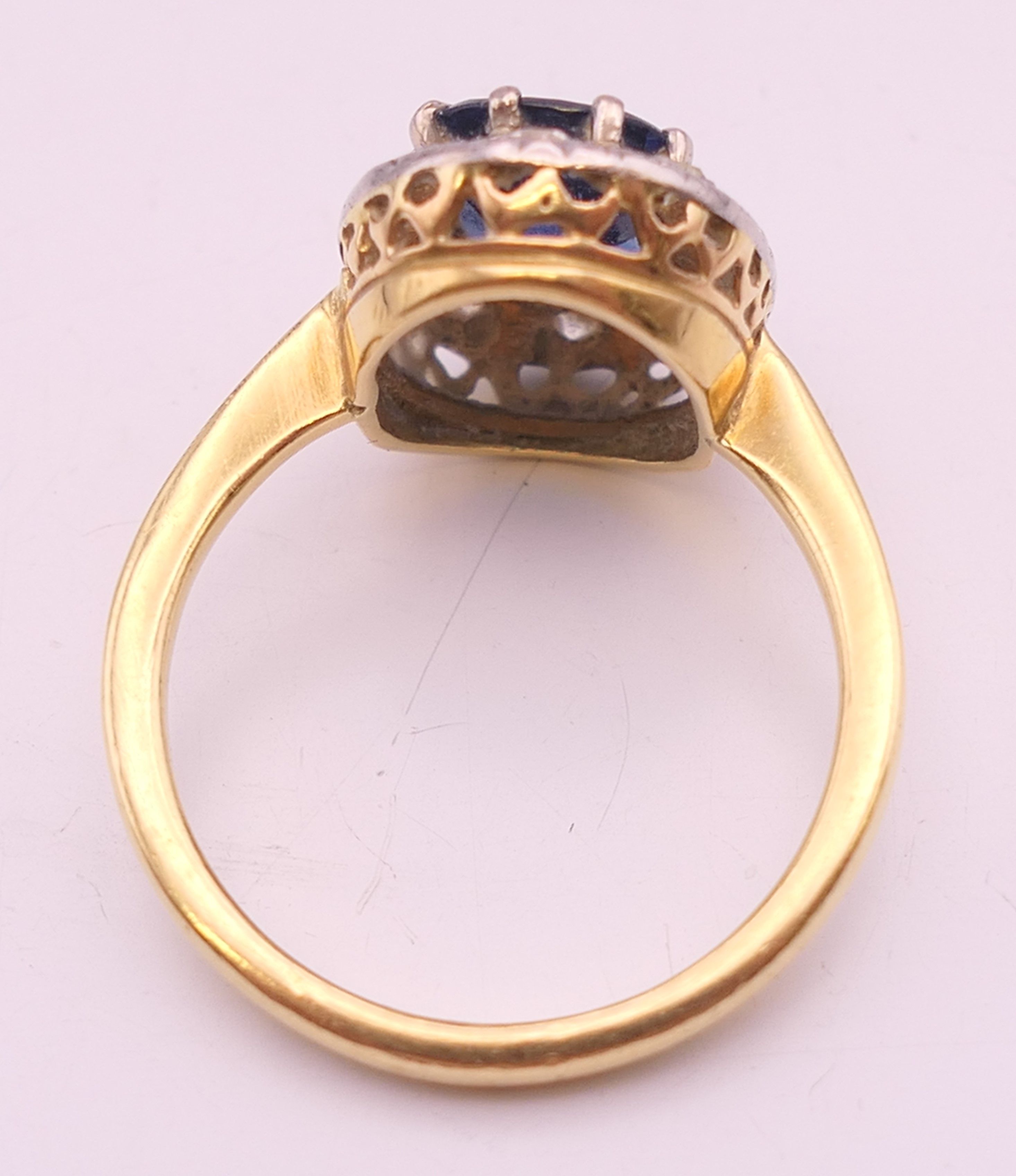 An unmarked gold sapphire and diamond ring. Ring size M/N. 4.2 grammes total weight. - Image 6 of 6