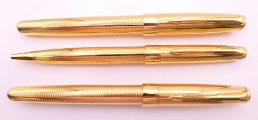 Three Parker pens in a leather case including a fountain pen with 18K gold nib.