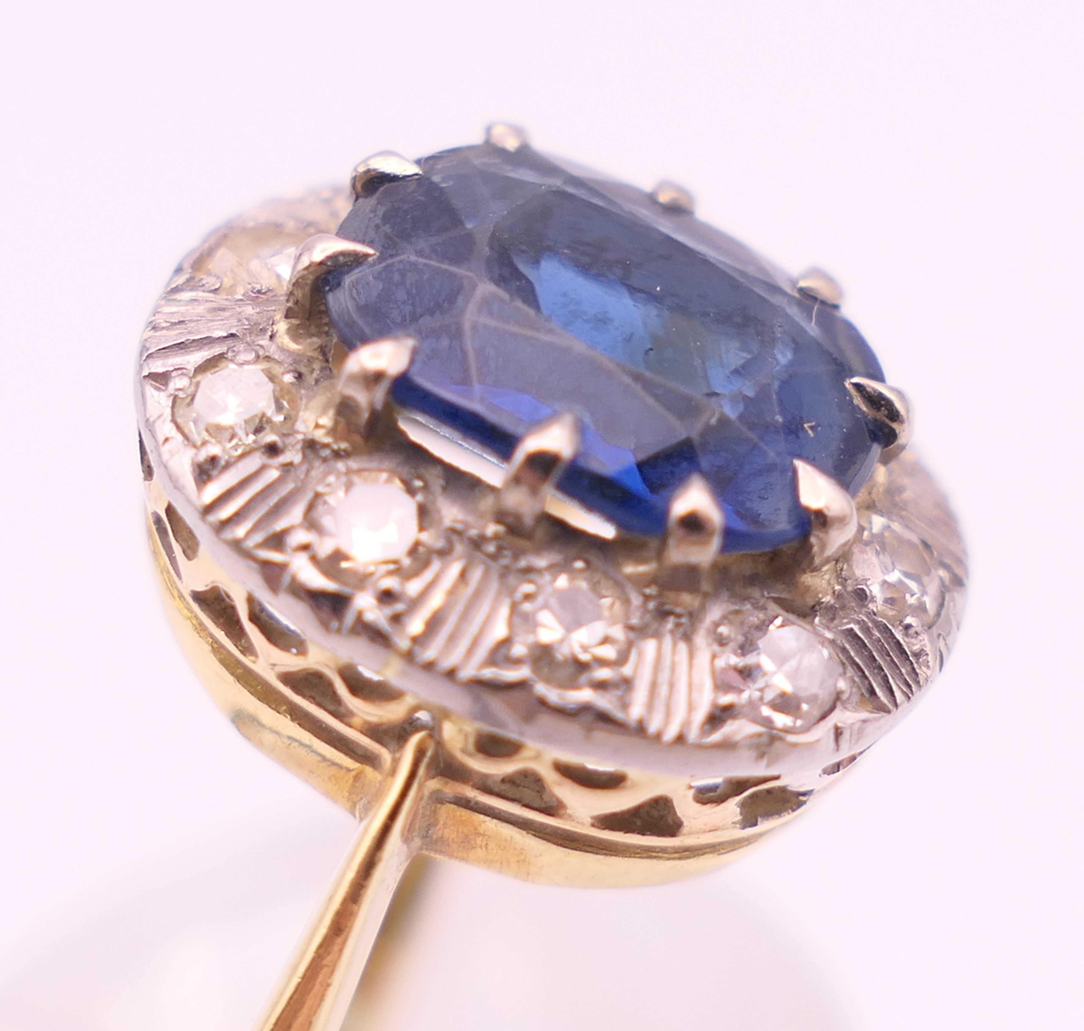 An unmarked gold sapphire and diamond ring. Ring size M/N. 4.2 grammes total weight. - Image 5 of 6