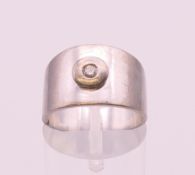 An unmarked white metal brilliant cut diamond solitaire ring. Ring size N.