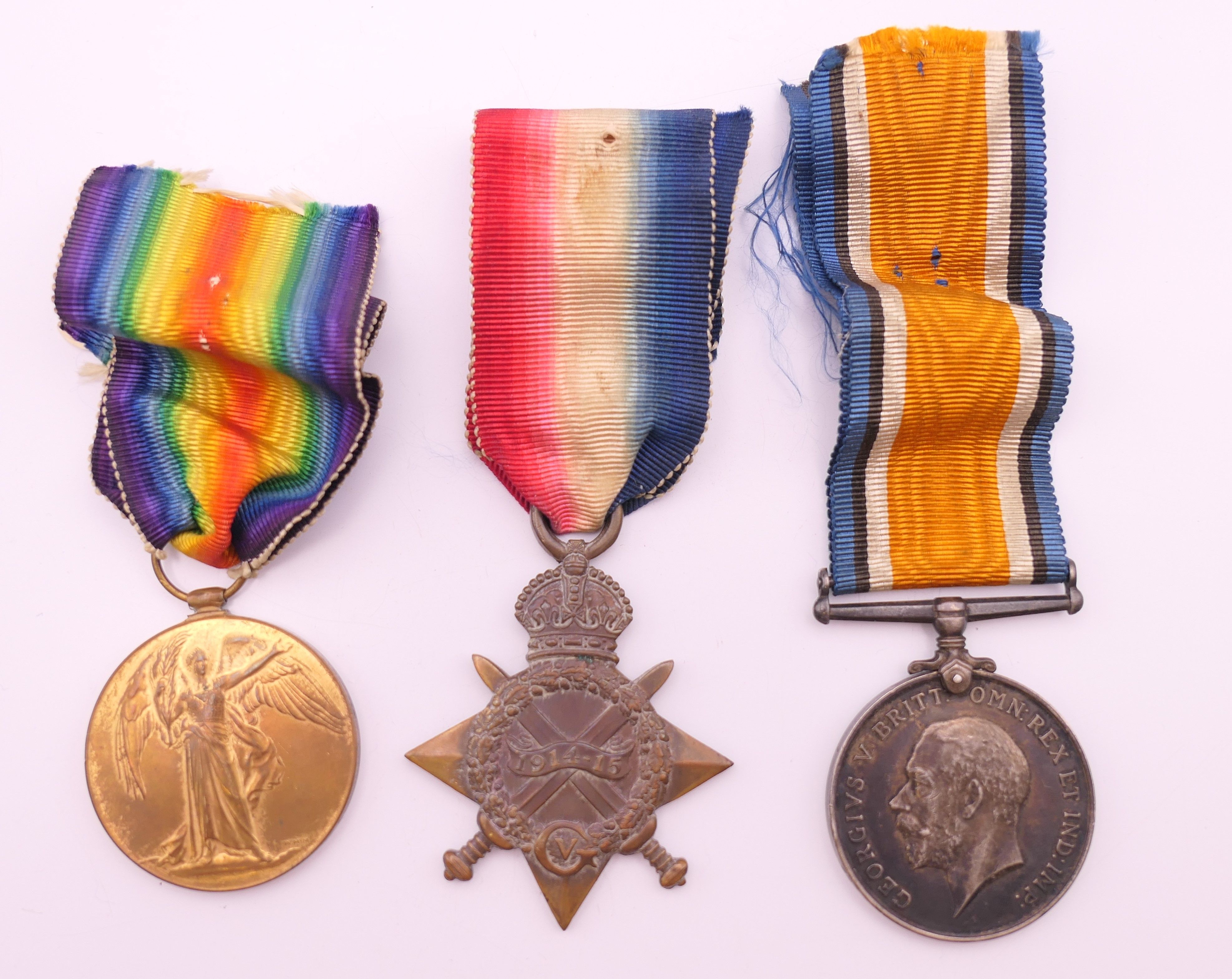 A trio of first world war medals awarded to 35116 DVR T BARRATT RA.