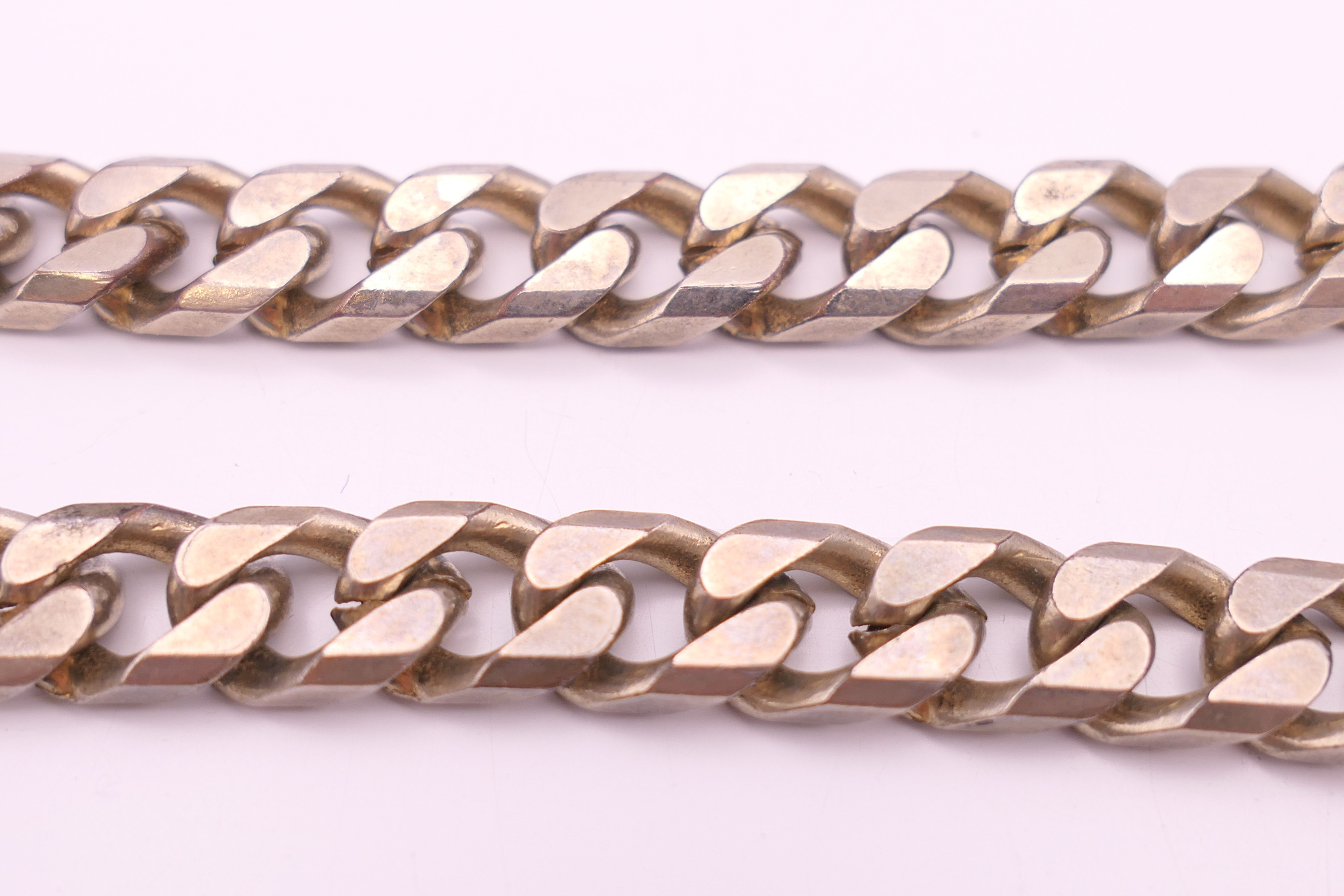A silver and cubic zirconia ring, another ring and a chain. Chain 47 cm long. - Image 3 of 7