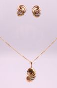 A pair of tri-colour gold earrings and pendant on a 9 ct gold chain. Earrings 2.