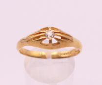 A large early 20th century 18 ct gold diamond solitaire gypsy ring, Ring size Z. 4.