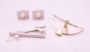 A pair of silver cufflinks and matching tie pin with cultured pearl and another item.